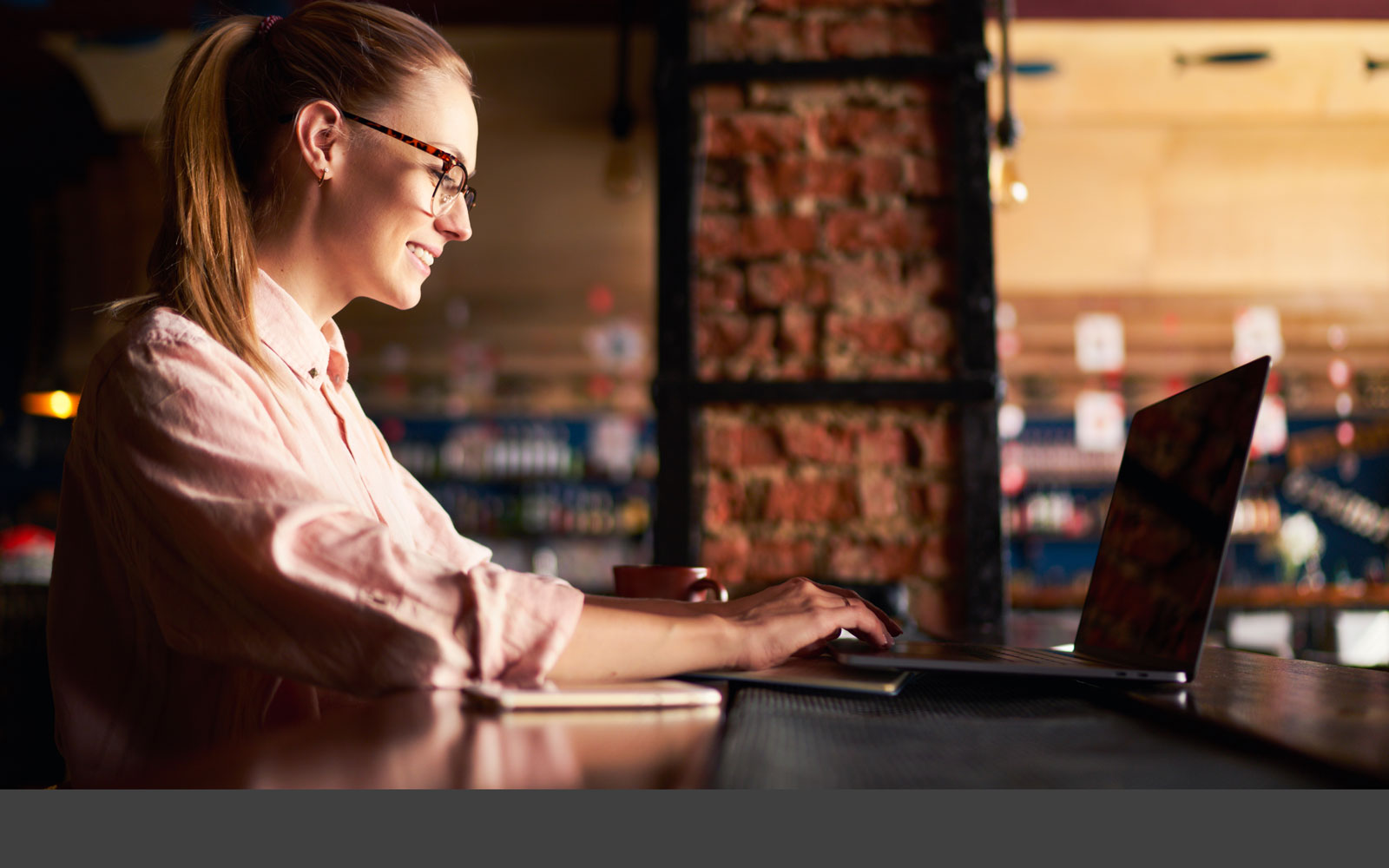 woman doing work on her laptop