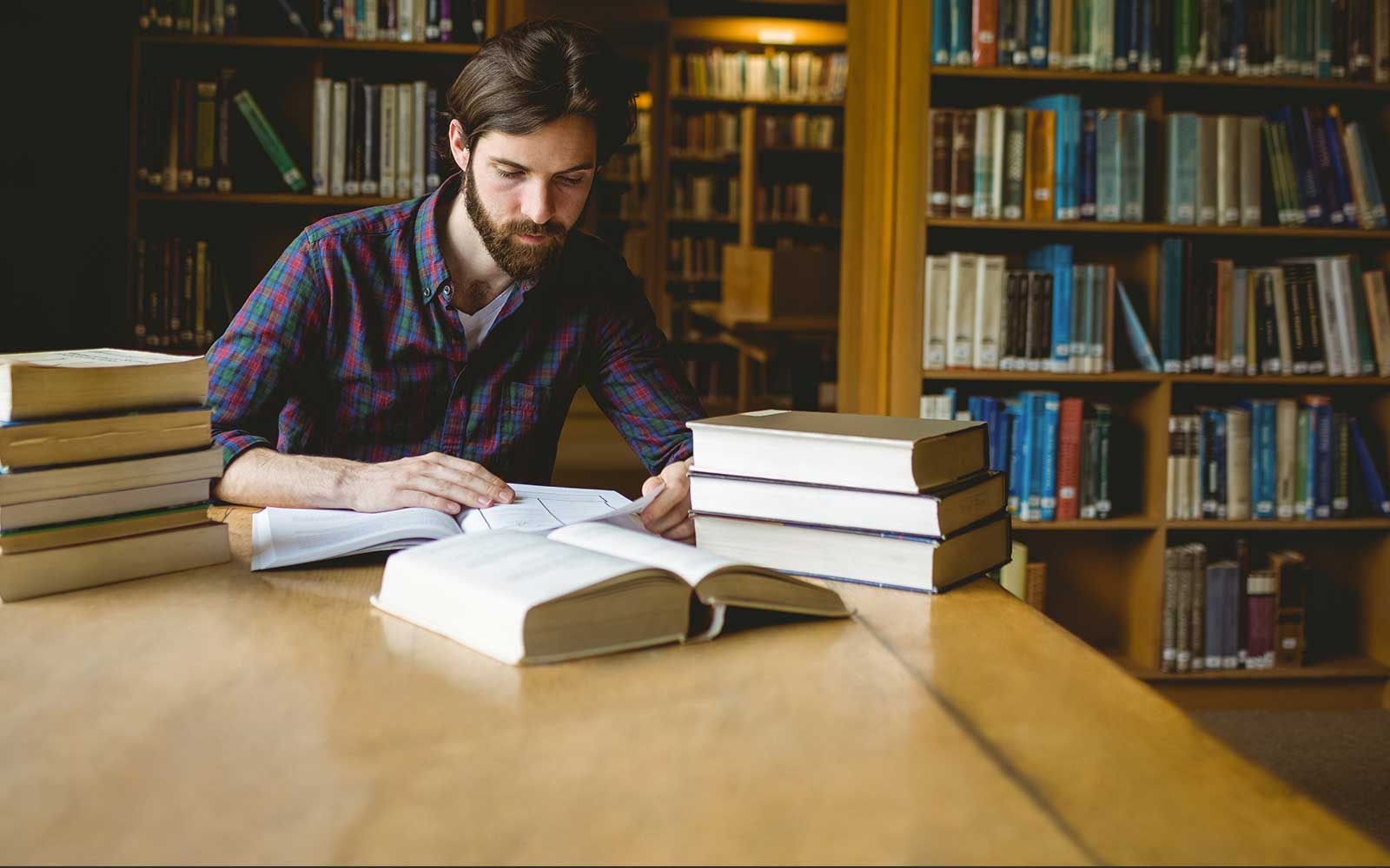 Man studying in library