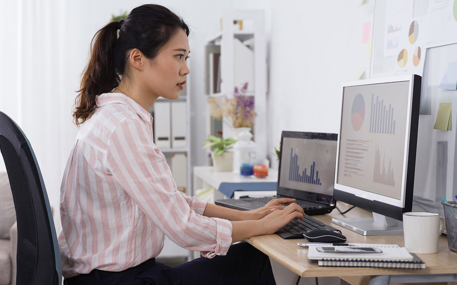 Data analyst working at her computer