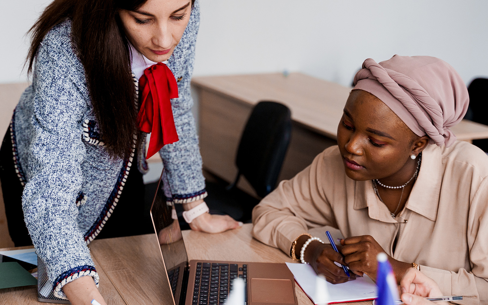 teacher working with a student