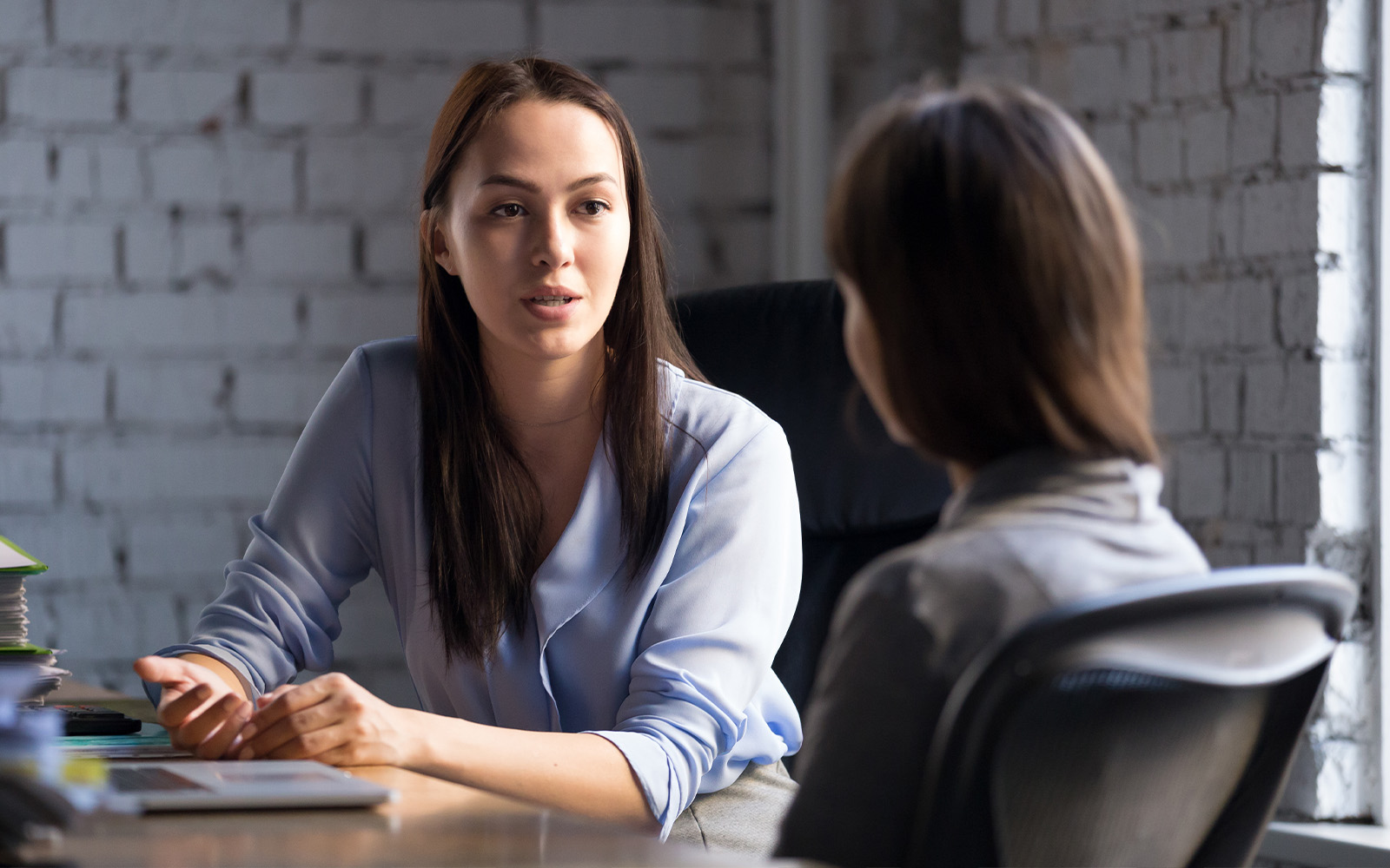 Women in meeting talking
