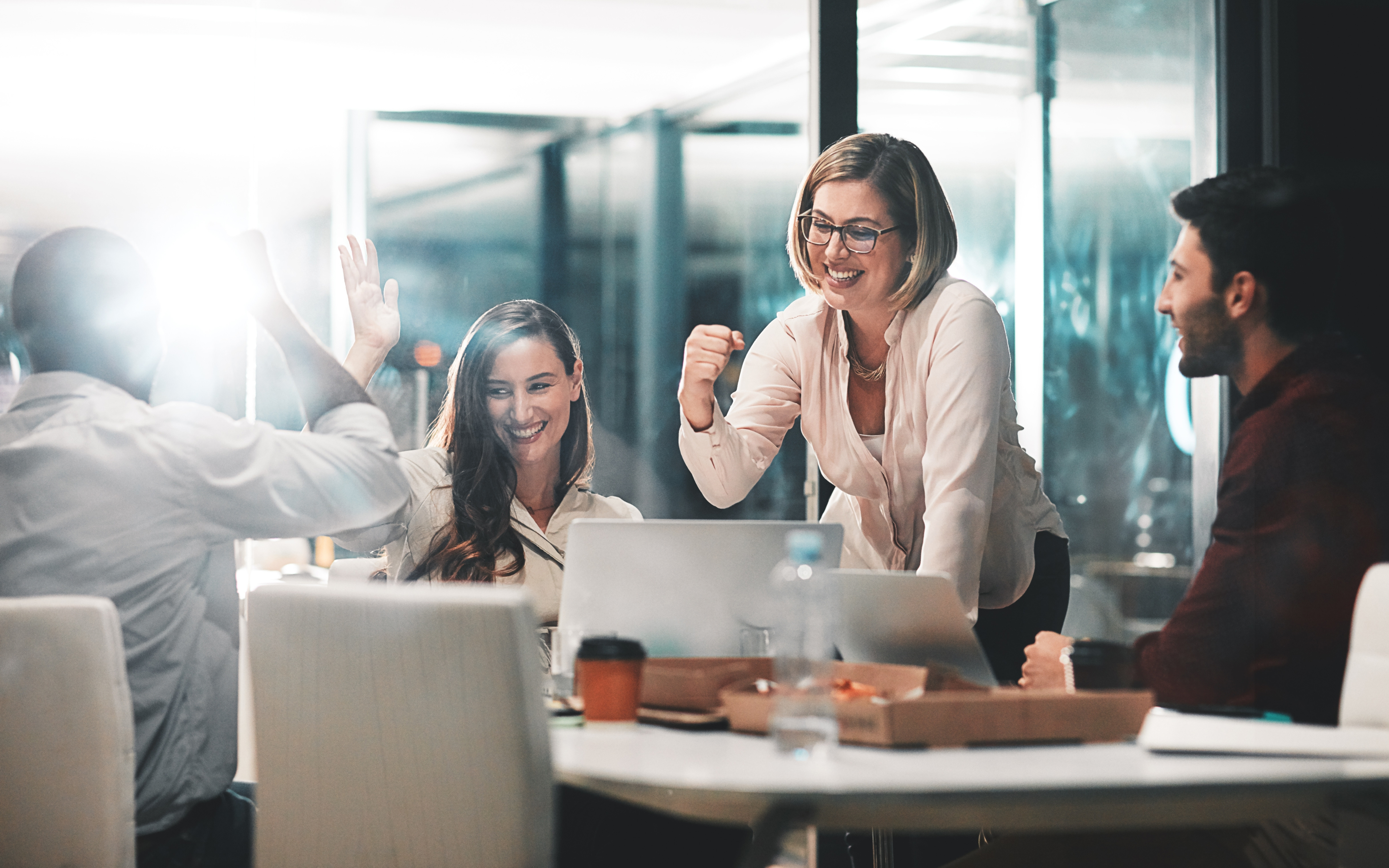 Team celebrating in a conference room
