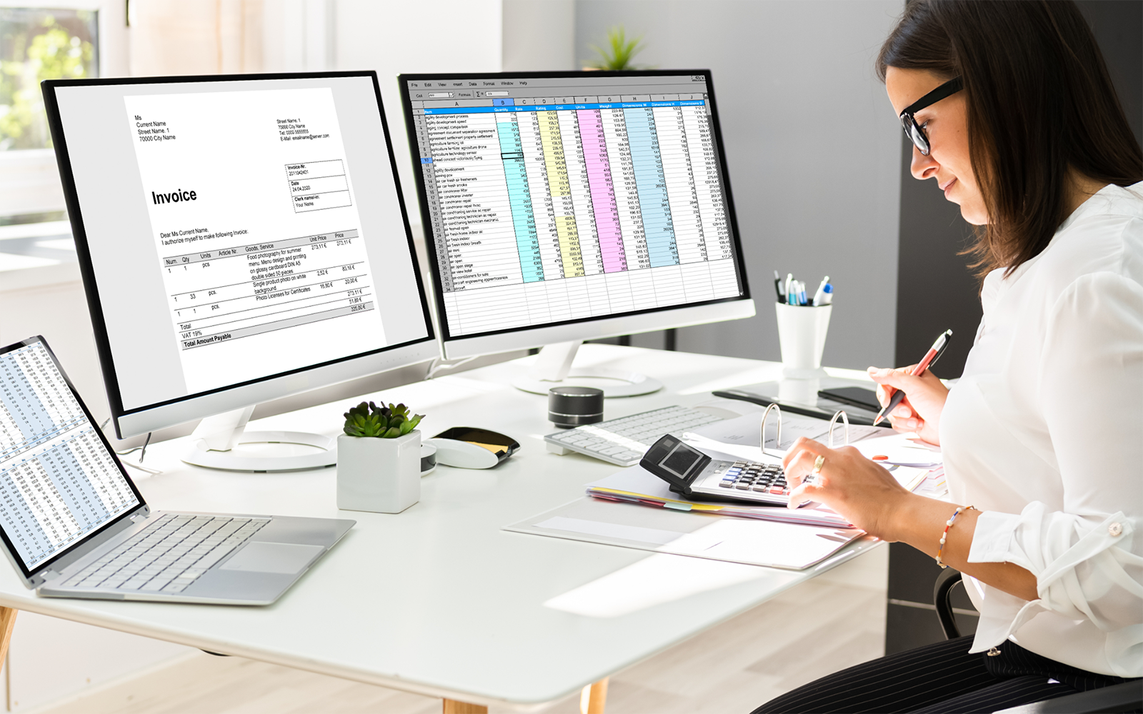 Woman sitting at her desk smiling
