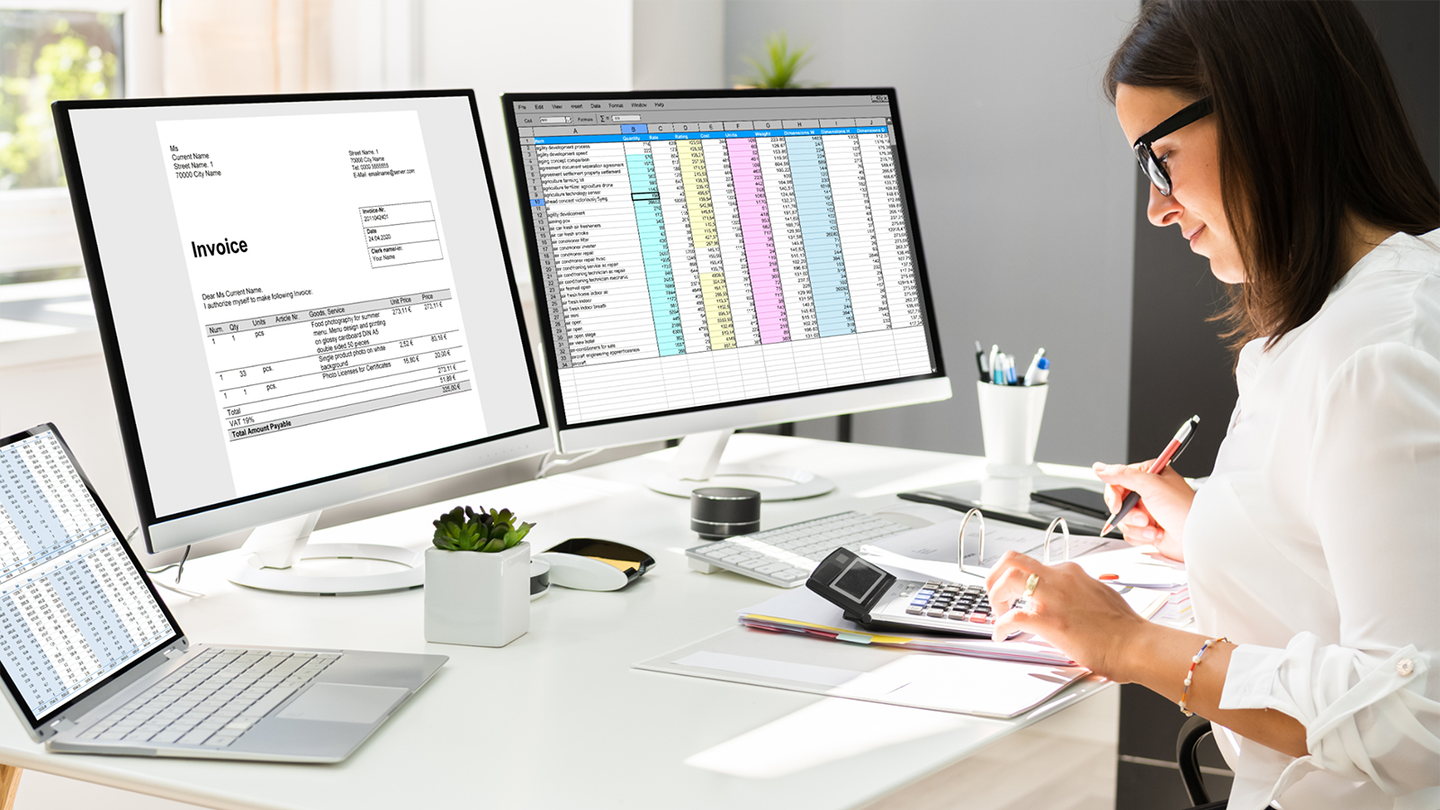 Woman sitting at her desk smiling