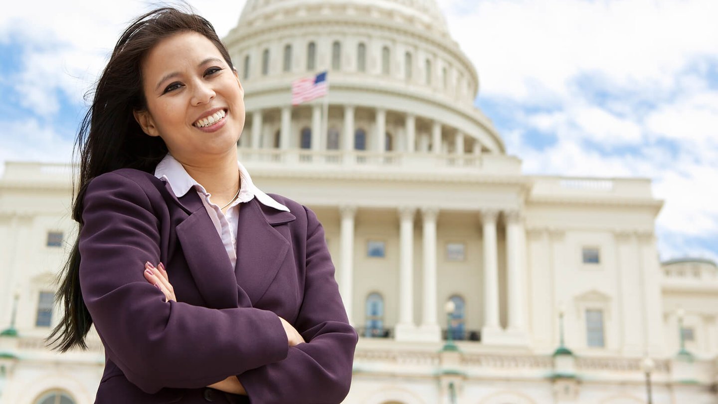 Woman standing in front of US Capital