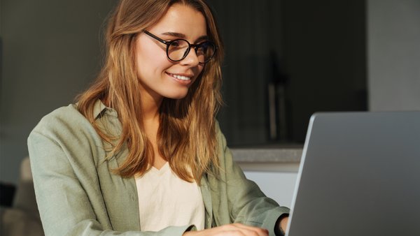 Female student studying at laptop