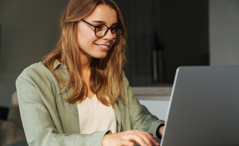 Female student studying at laptop