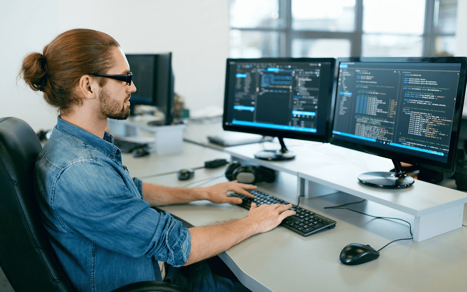 Information tech working on a computer