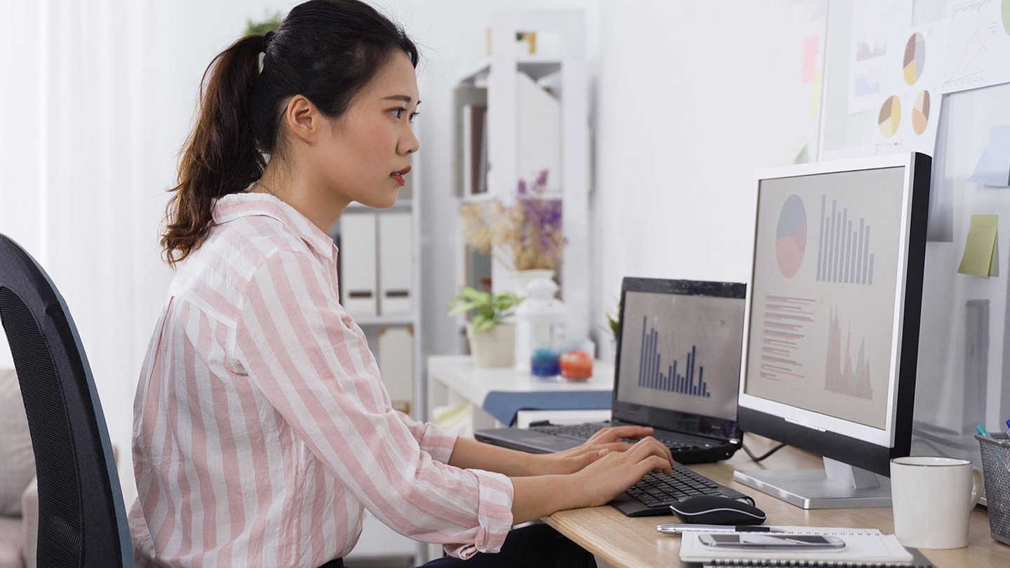 Data analyst working at her computer