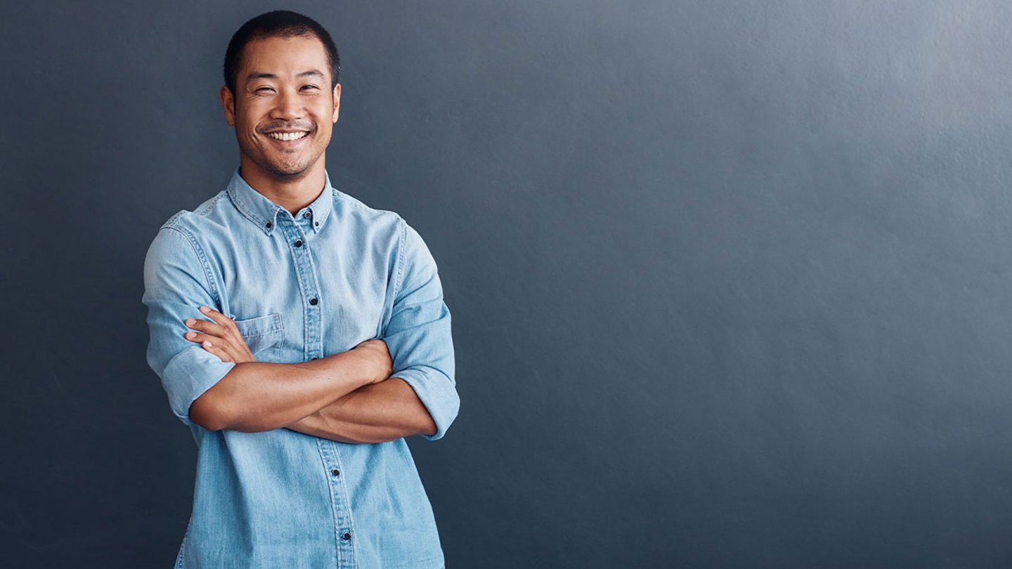 Digital Marketer with arms crossed smiling