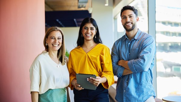 Group of diverse professional coworkers standing together