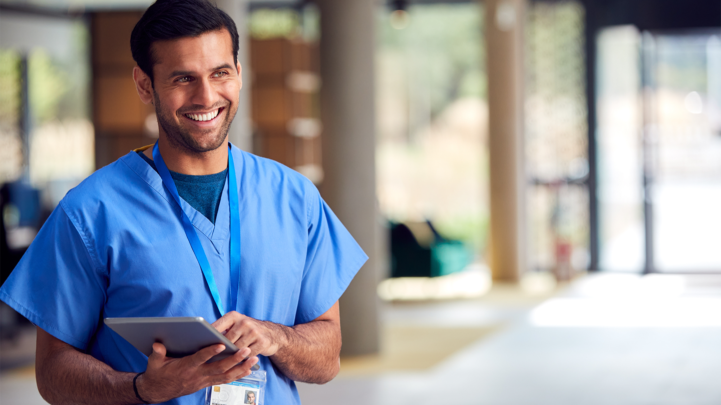 Male nurse taking notes