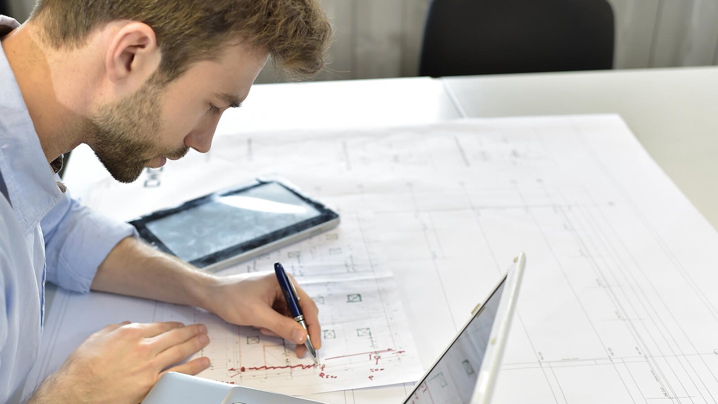 Construction engineer reviewing plans