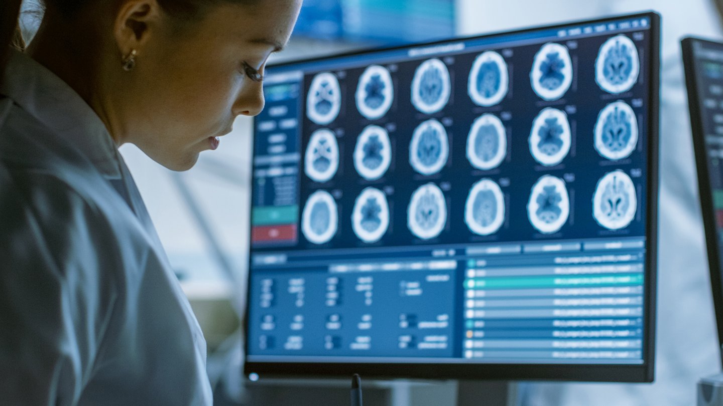 Healthcare professional reviewing medical imaging