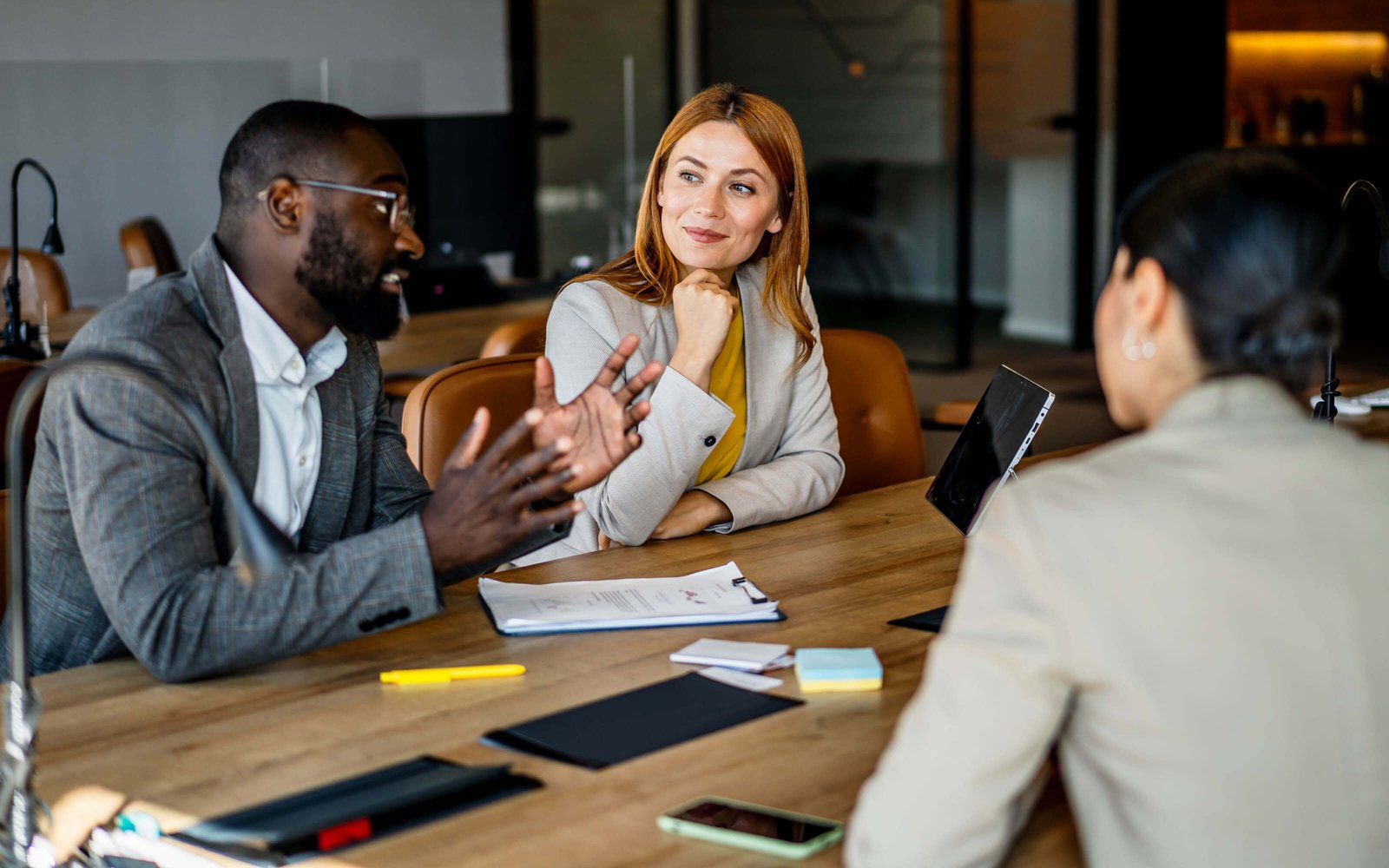 A group of marketing professionals discussing in a meeting