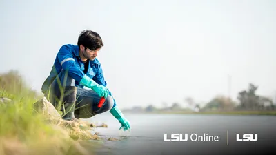 Coastal environmental science student taking water samples at the beach