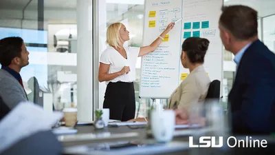 People in a meeting room listening to a presentation