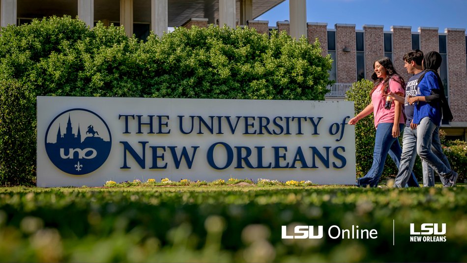 Students walking in front of University of New Orleans signage.