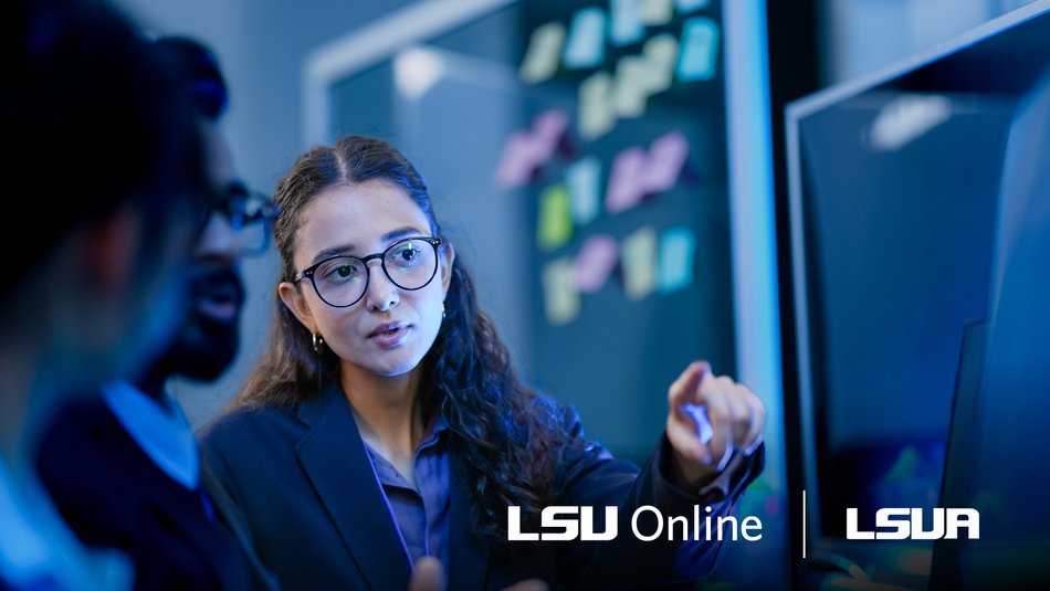 CS student working alongside peers in professional attire