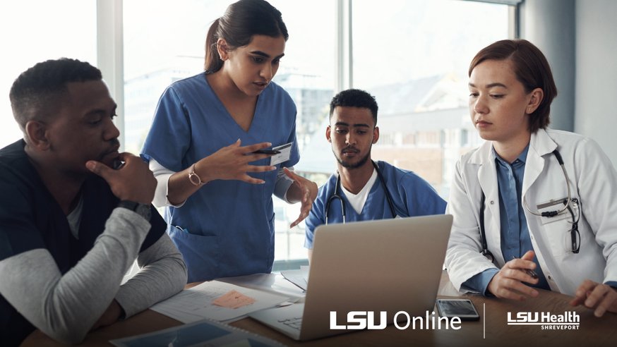 Healthcare workers gathered around a computer