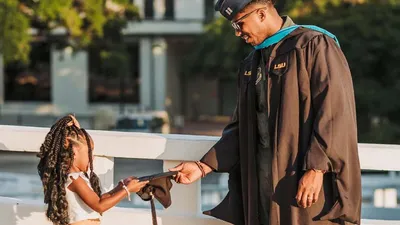 Father celebrates graduation with daughter