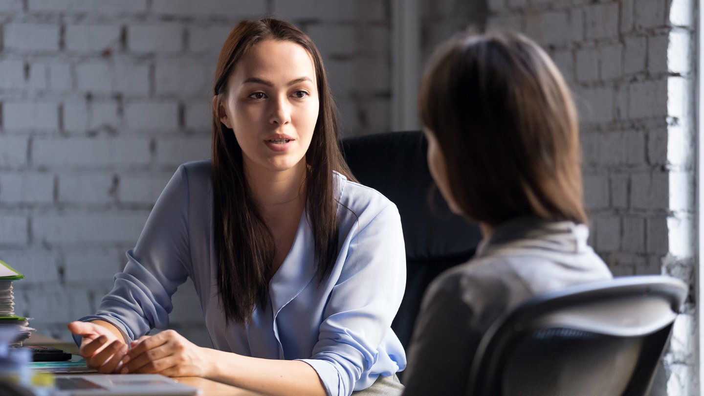 Women in meeting talking
