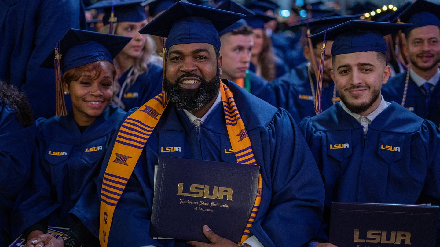 LSUA Graduate with diploma