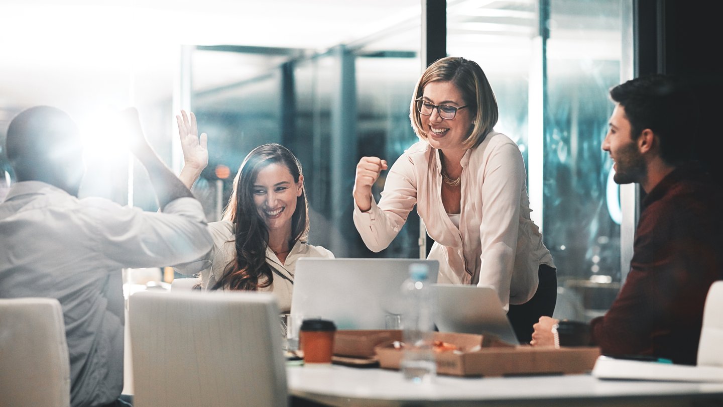 Team celebrating in a conference room