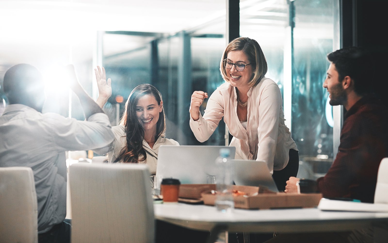 Team celebrating in a conference room