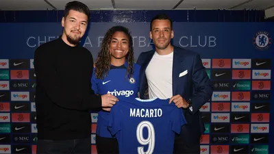 LSUS graduate Takumi Jeannin stands with Chelsea’s Catarina Macario