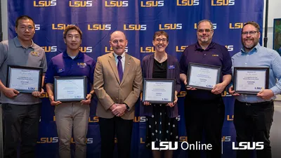 LSUS Faculty holding their awards
