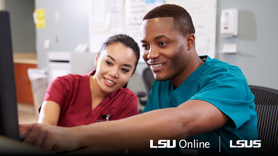 Two healthcare workers looking at a computer screen