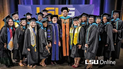 LSUS graduates standing with Dr. Zeeshan Noor