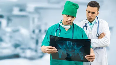 Healthcare workers reviewing x-ray