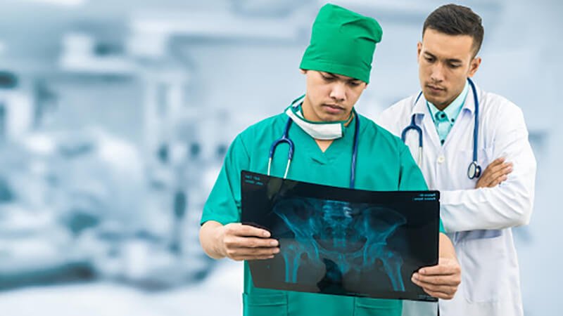 Healthcare workers reviewing x-ray