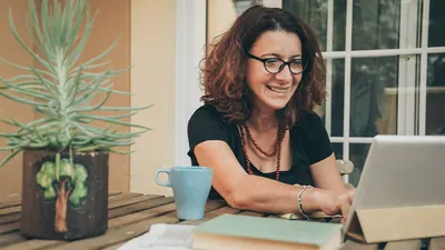 Online woman student studying laptop and book