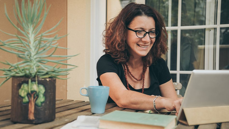 Online woman student studying laptop and book