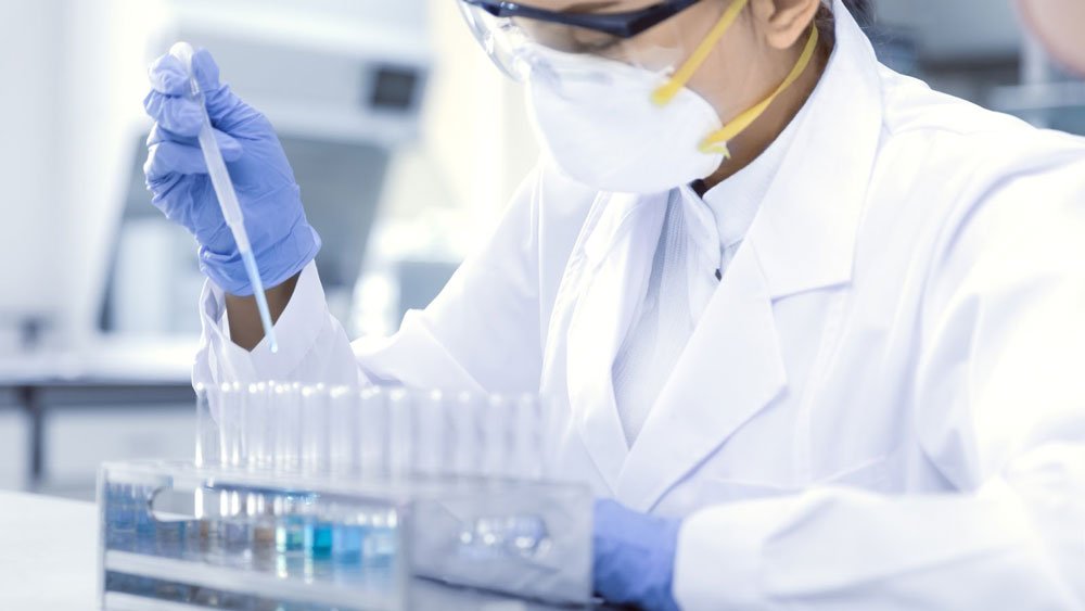 Laboratory scientist testing samples.