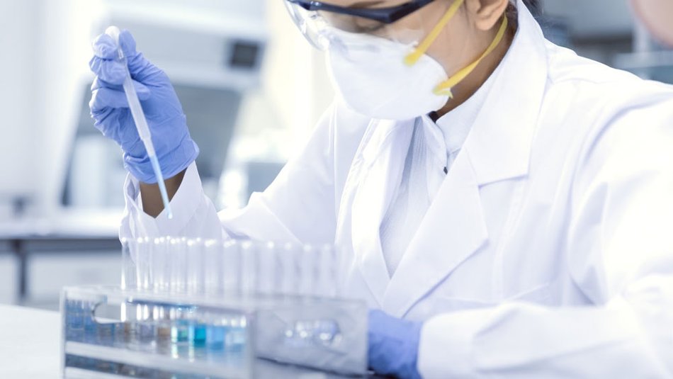 Laboratory scientist testing samples.