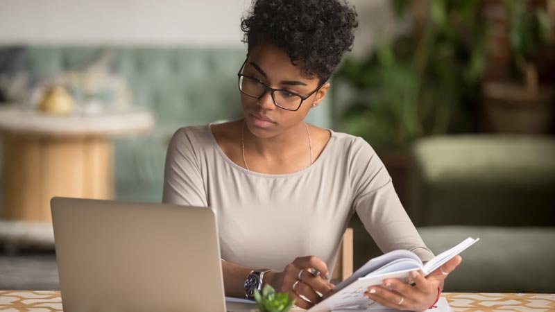 woman studying a book