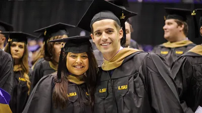 Picture of two MBA graduates