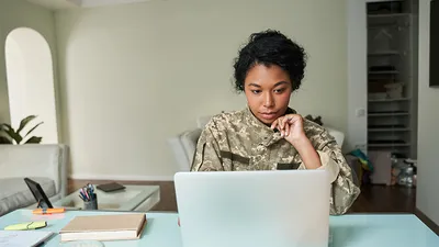 Army woman on laptop