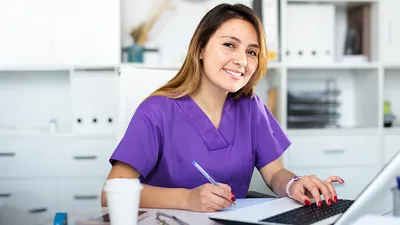 Healthcare professional working in front of computer