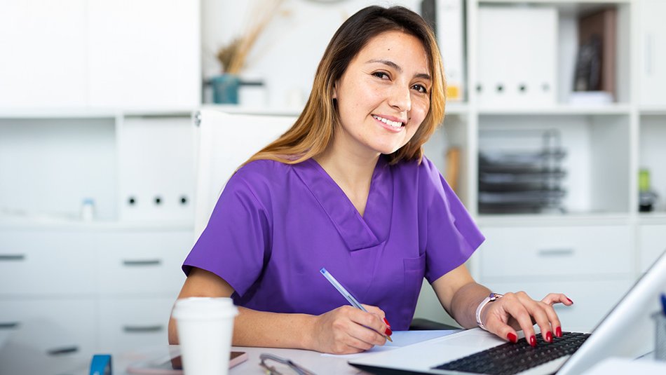 Healthcare professional working in front of computer