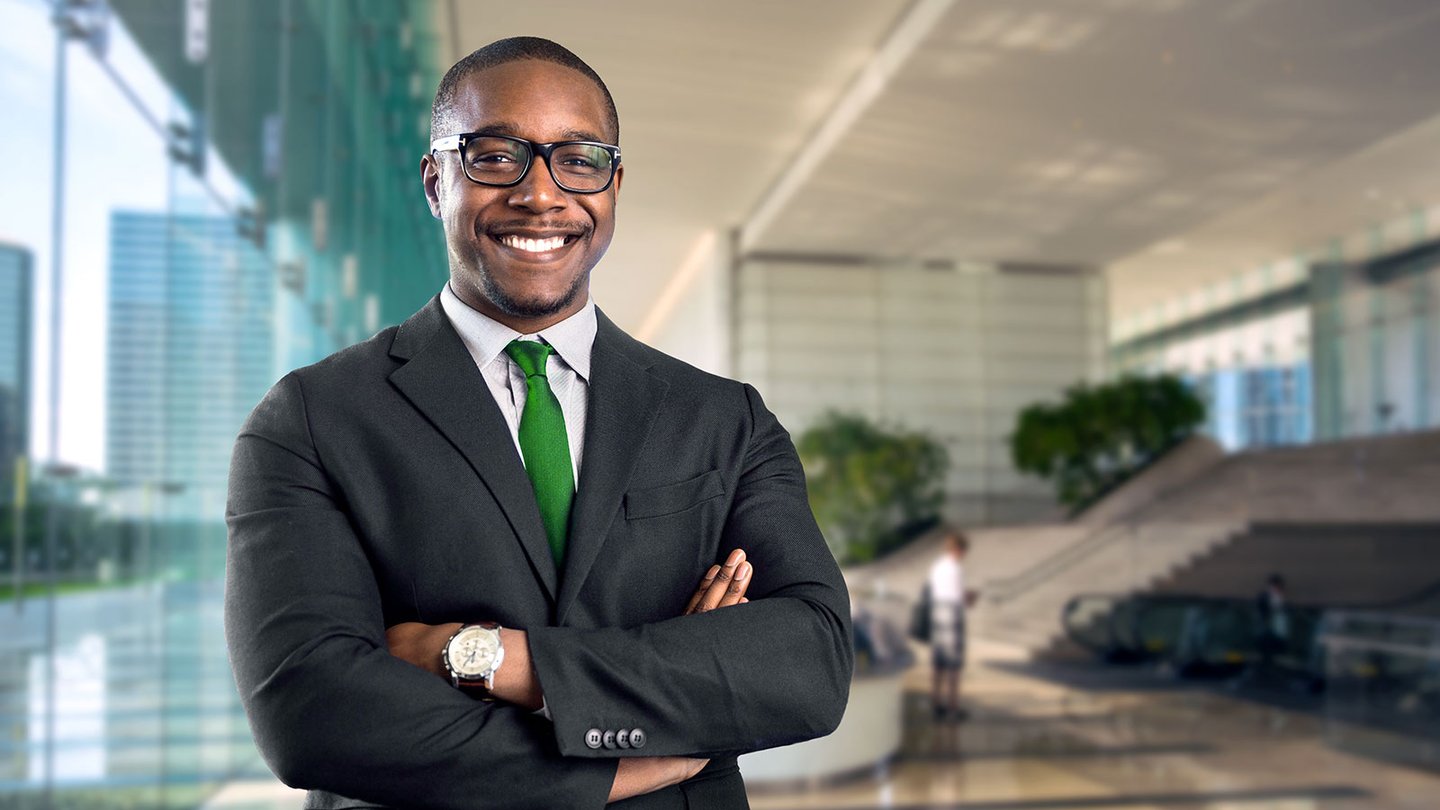 IT Manager with his arms crossed smiling
