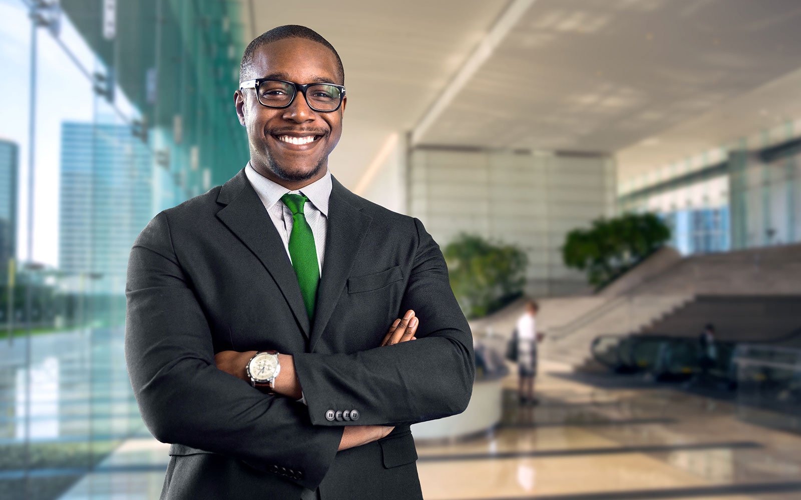 IT Manager with his arms crossed smiling