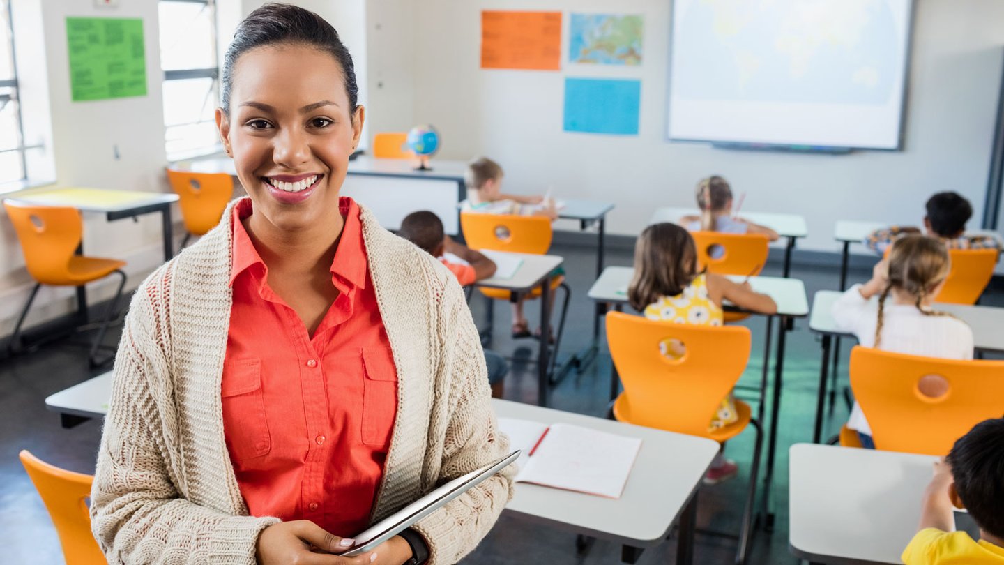 teacher standing in classroom