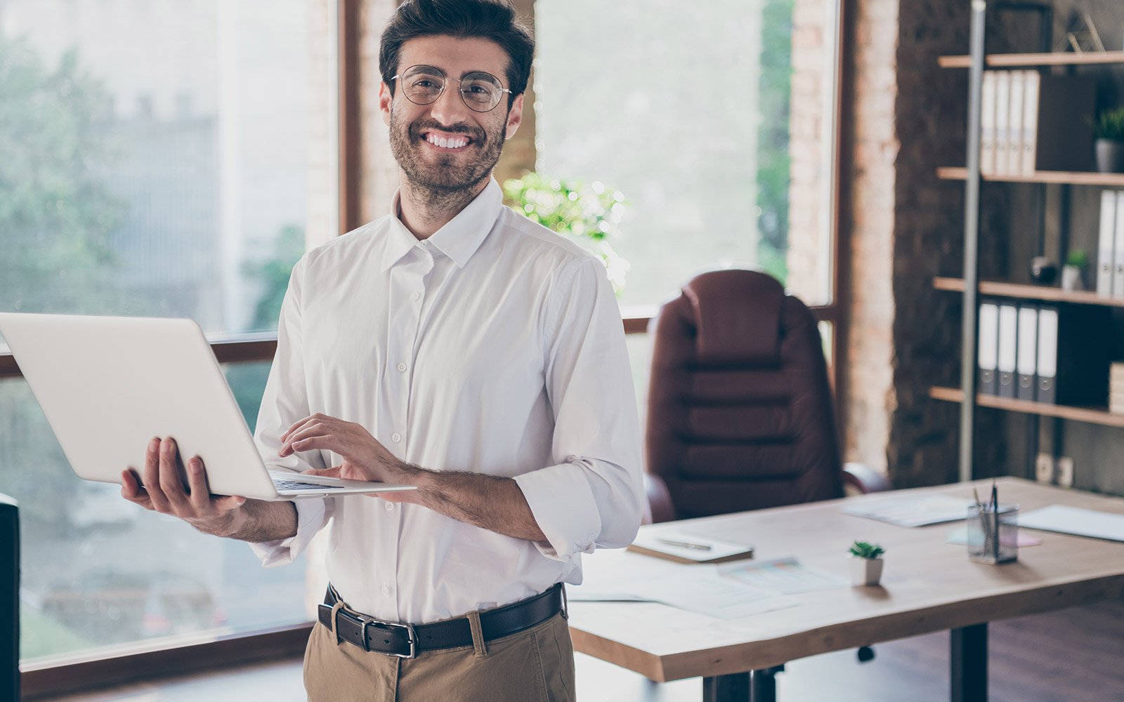 Financial advisor holding a laptop