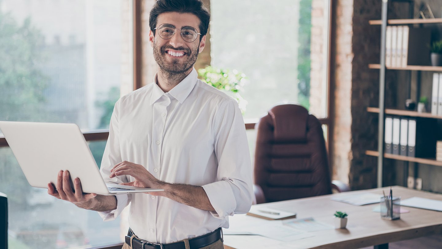 Financial advisor holding a laptop
