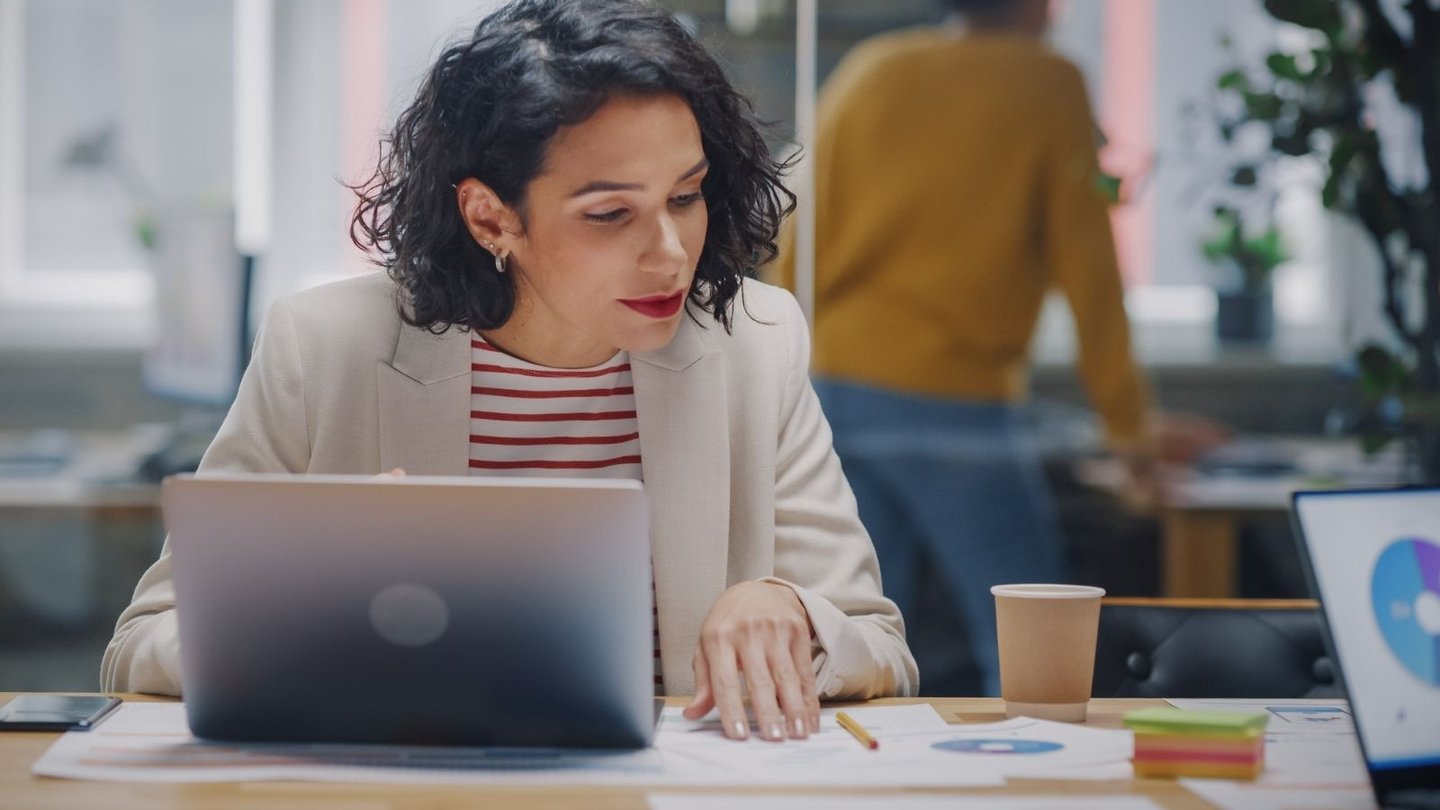 International business manager working at her desk